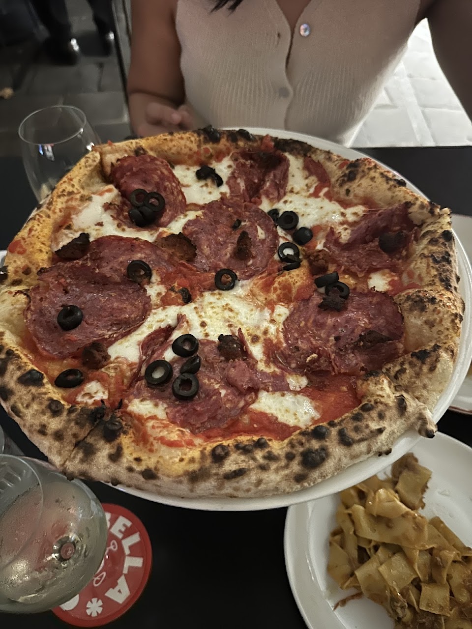 Wood-fired pizza at Bellucci Cucina